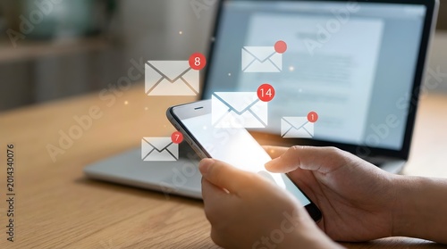 Mobile email marketing notification campaign with smartphone and laptop