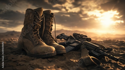 Tactical Military Combat Boots and Assault Rifle on Desert Ground at Sunset
