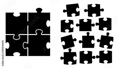 фотографія Black jigsaw puzzle pieces arranged in a group and a connected square formation