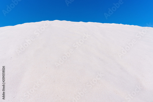Obraz na plátně White Salt Mound Against Clear Blue Sky at Kalloni Salt Pans Greece