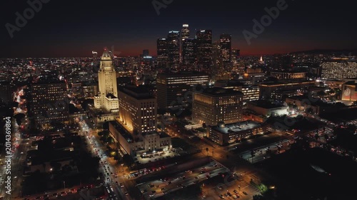 Aerial photograph of the city of Los Angeles, showing buildings, lights, and vehicular traffic.