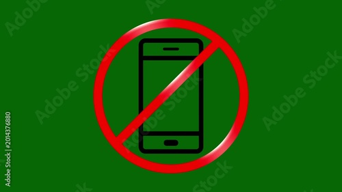 No phone zone: A bold symbol against the vibrant green backdrop indicates a designated area free from phone usage.