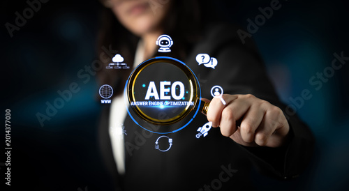 Fotografía Business Professional Holding Magnifying Glass Emphasizing Answer Engine Optimization with Digital Icons in Background for Marketing and Technology Concepts Fluxor