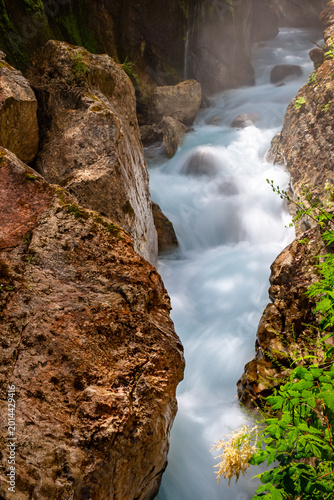 Wimbachklamm is a stunning gorge with waterfalls and flowing river water in Bayern, Germany.