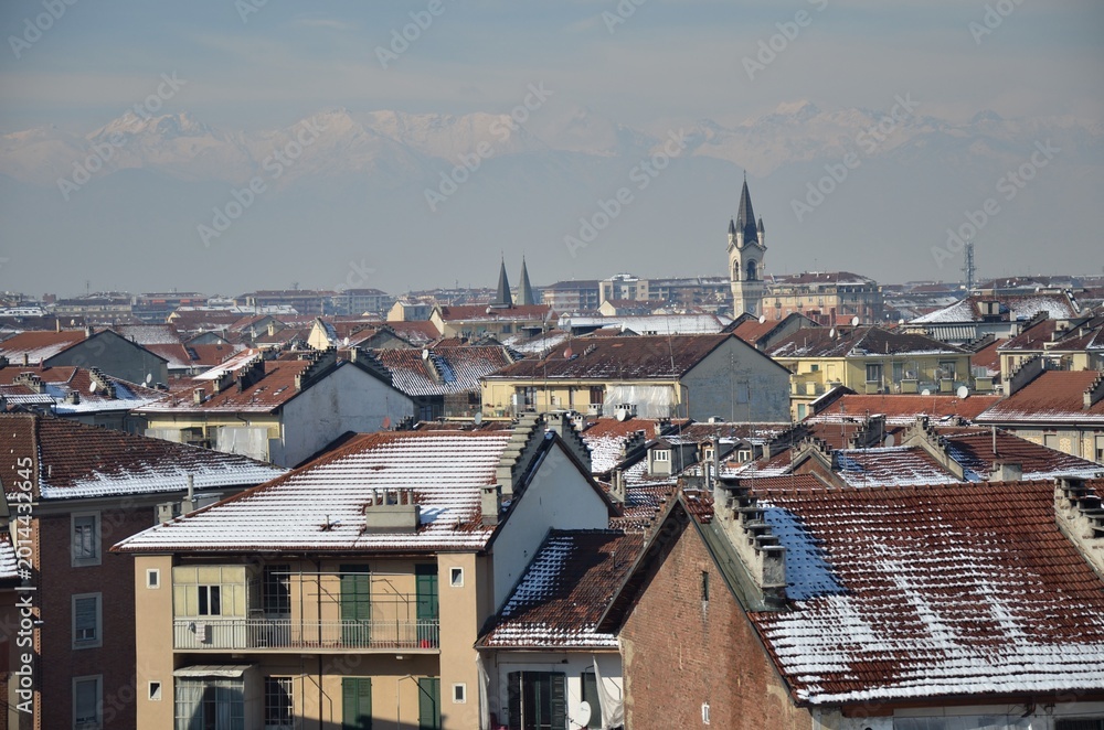 Obraz premium Snow Covered Rooftops in Turin Italy with Alps Mountain Range