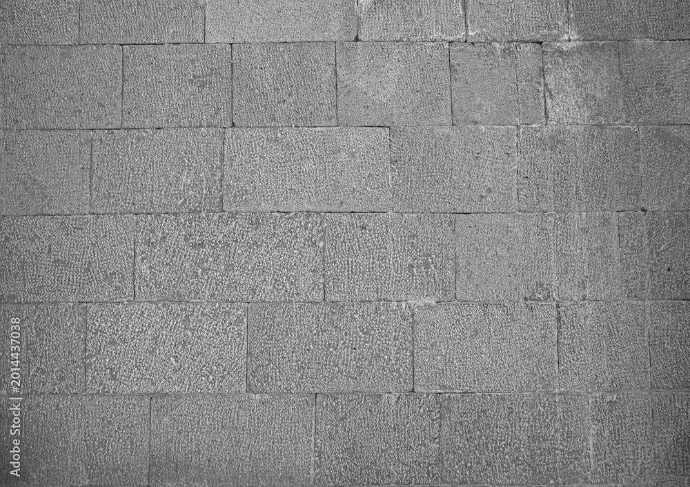 Fototapeta premium Front view of a wall made of gray slabs. background of a new and modern wall or building exterior grey slabs Marble brick pattern floor abstract natural marble black gray wall Top view and front view