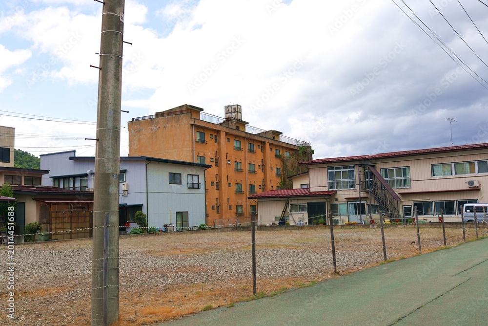 Naklejka premium May 4, 2026, Kaminoyama City, Yamagata Prefecture.A scene from an abandoned apartment building.