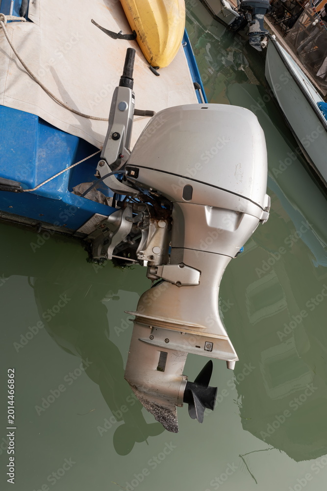 Fototapeta premium Outboard motor on small boat in Venice canal