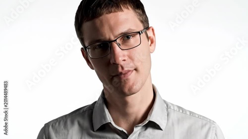 Young Man with Glasses Posing on White Background with Various Expressions.