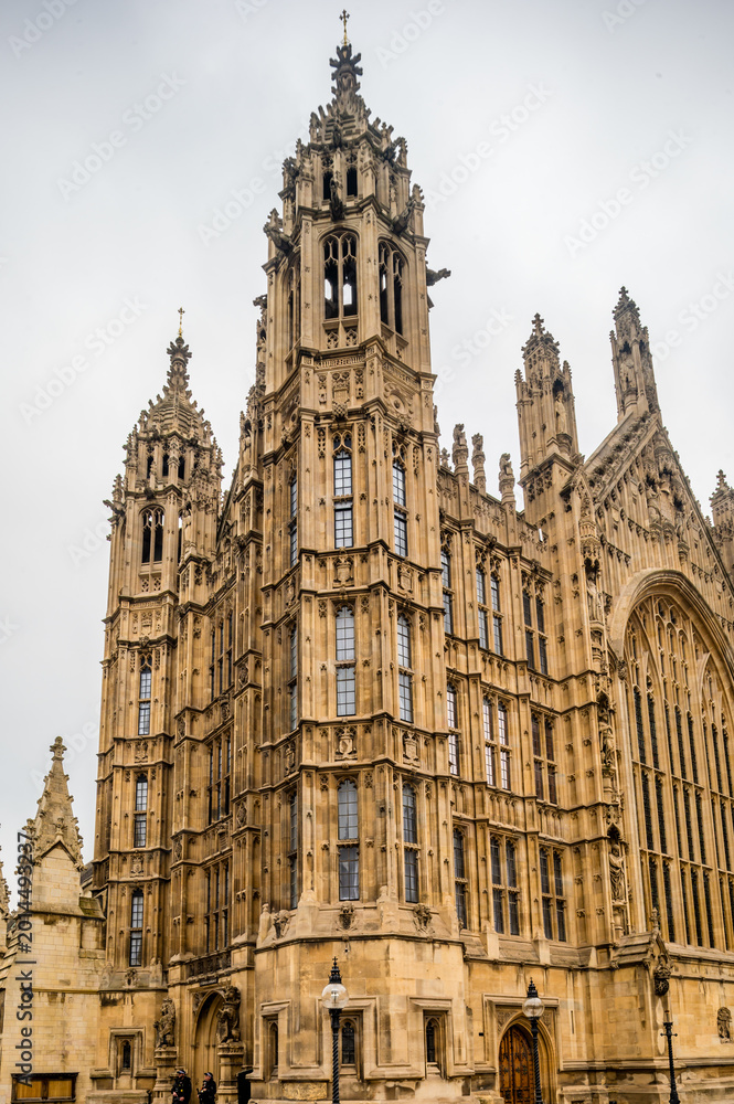 Obraz premium Historic Gothic Revival Government Architecture with Ornate Stone Facade Towers and Grand Arched Entrance Details