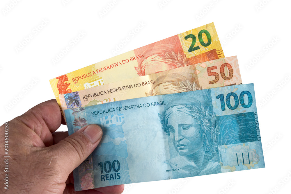 Obraz premium Brazil: Financial value of Brazilian Real banknotes representing the currency in the monetary economy. Bank business.