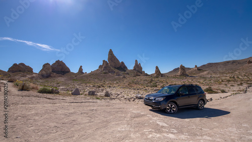 Obraz na plátně SUV parked in the alien-like landscape of Trona Pinnacles.