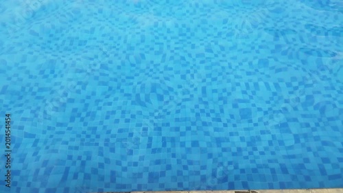 Entering a Calm Pool Scene with Clear Blue Water