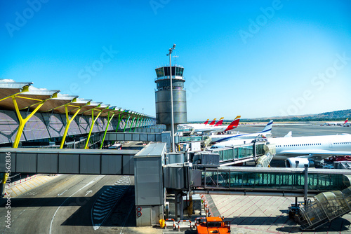 Terminal 4 at Madrid Airport with parked aircraft on a sunny day