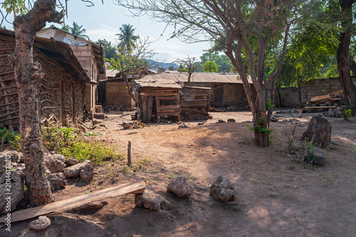 wattle and daub houses and shed surrounding village gathering space in mto wa mbu tanzania africa