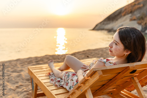 Woman in dress on the beach.