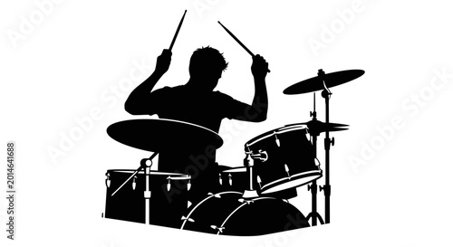 Foto Silhouette of a drummer playing a drum set with drumsticks
