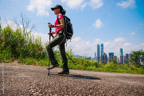 Canvas Print Woman hiking on mountain top in Hong Kong