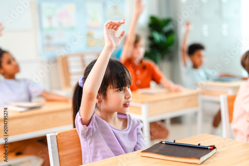 Bild auf Leinwand Back to school and education concept of school classroom child student raised ha