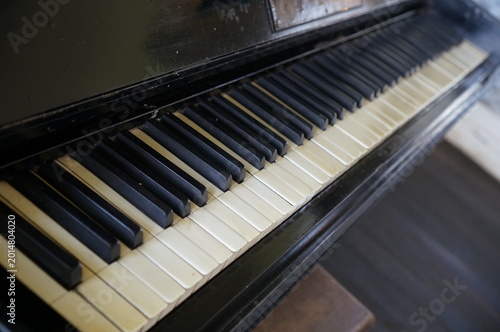 A close-up of a vintage piano keyboard