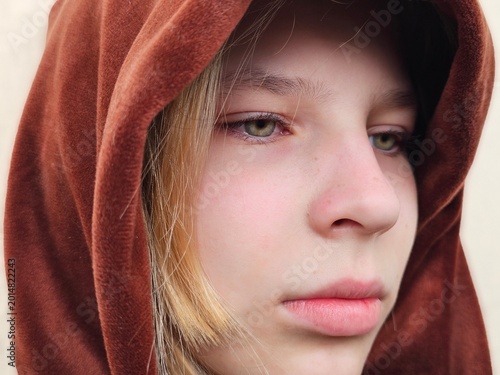 Fotografie A sad, lonely teenager. Portrait of a girl in tears, pain, grief