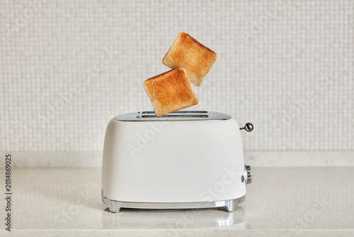 Toast popping from toaster, dynamic breakfast moment
