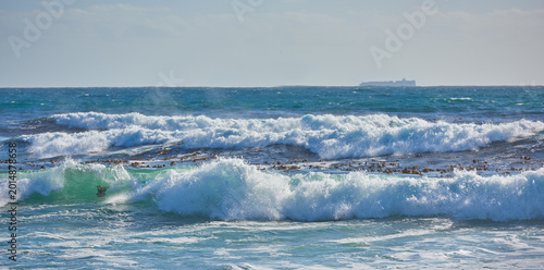 Фотография Waves, sky and landscape with ocean and beach for environment, tropical horizon and summer vacation
