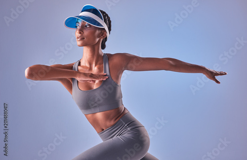 Fotografie Training, stretching and thinking with woman in studio for health, vision or workout development