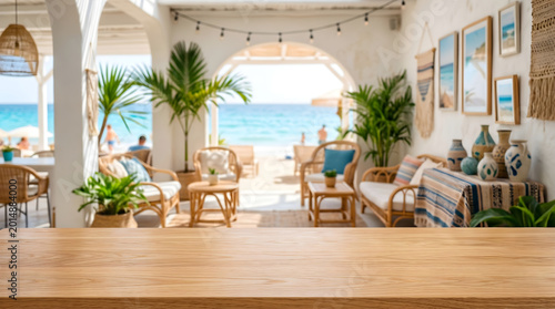 Empty wooden tabletop background with blurred luxury coastal beach resort patio interior for product display