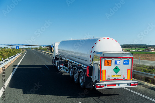 Tableau sur toile Carbon Dioxide Tanker Truck with Hazard Labels Driving on Highway,TIR transport