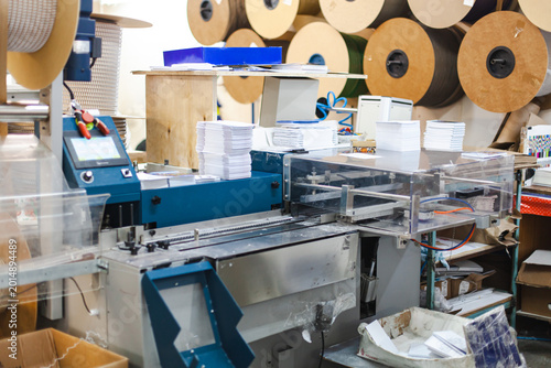 Canvas Print Automated printing and finishing workflow in commercial printshop - machinery for folding, stacking and processing large volumes of paper