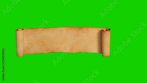 Vintage blank parchment scroll with torn edges on dark brown wood texture background. Ancient parchment scroll banner on dark wooden table. Isolated, green chromakey, luma matte included.