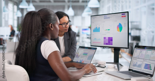 Photos Business Analyst Reviewing Financial Dashboard Data Carefully