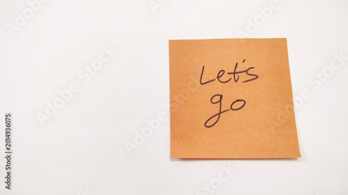Quadro em tela Let's go sticky note on white background