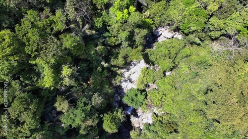 Aerial view of beautiful mountain forest lake with waterfalls
