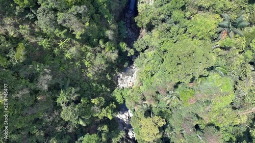 Aerial view of beautiful mountain forest lake with waterfalls