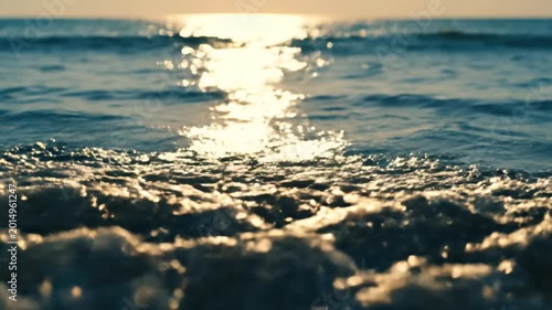 Ocean surface illuminated by sunlight sparkling water waves abstract nature