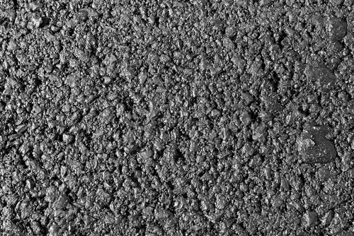 Konstfotografi Close-up image of an asphalt surface featuring small stones and gravel, highligh