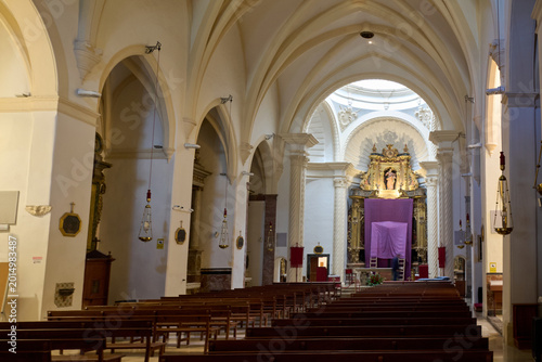 фотографія Interior view of a traditional catholic church sanctuary with rows of benches an
