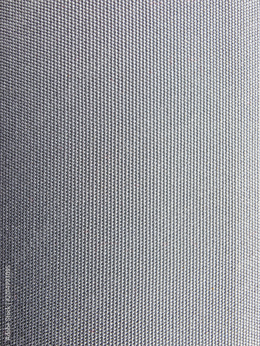 Tableau sur toile Close up of Gray surface with uniform black dots al over.