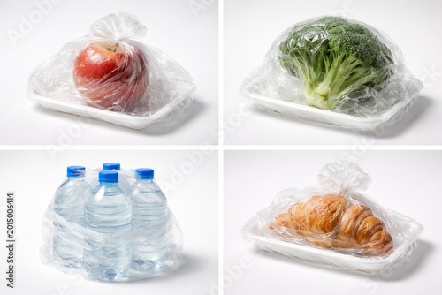 Plastic wrapped food items on disposable trays with bottled water - single-use packaging and waste concept
