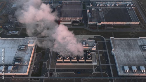 Aerial view of data center cooling system emitting steam