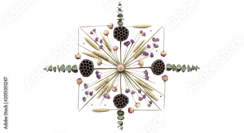 A symmetrical mandala crafted from dried flowers, seed pods, and eucalyptus leaves arranged on a.