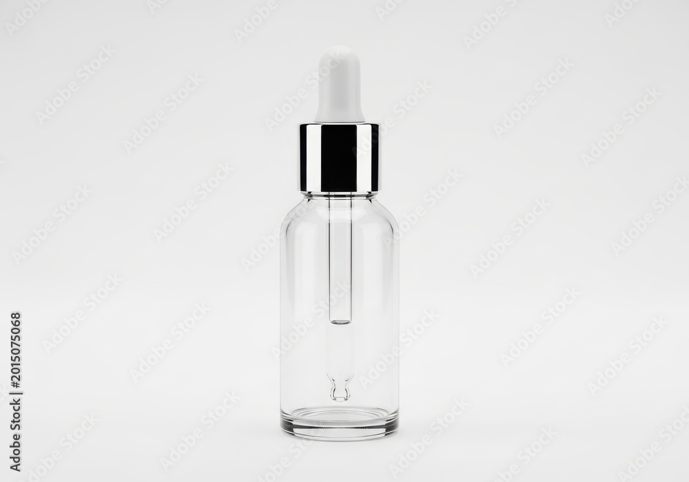 Naklejka premium Empty Clear Glass Dropper Bottle with Silver Cap and White Bulb Isolat