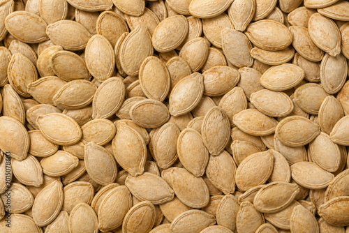 Close Up of Pumpkin Seeds in Shell Natural Snack Food Texture Background