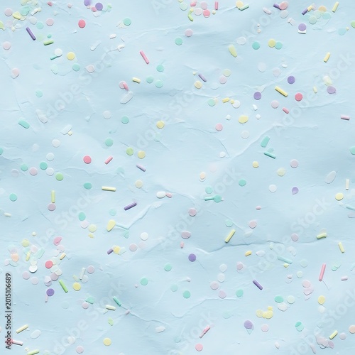 Abstract pastel blue background with confetti sprinkles for celebration