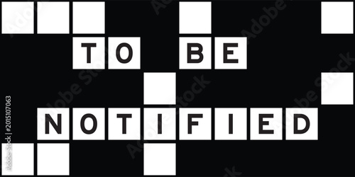 Photos Alphabet letter in word to be notified on crossword puzzle background