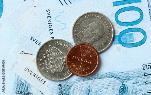 Fotografie Swedish krona money bills and coins on table
