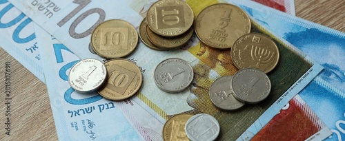 Photos Israeli shekel money bills and coins on table