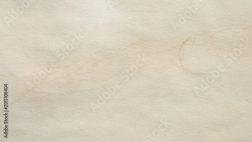 Old vintage paper texture background with aged stains and antique yellowed parchment effect